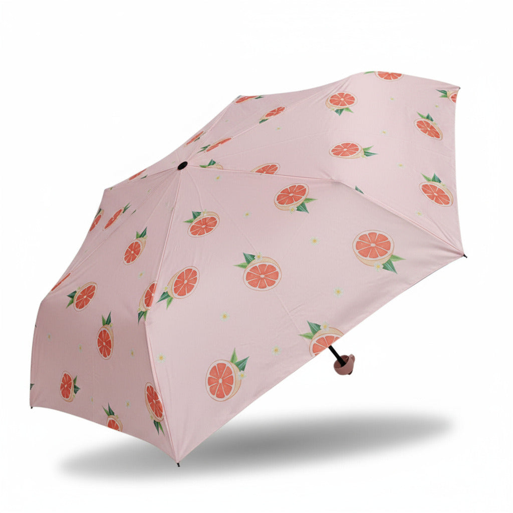 Handöffner-Regenschirm mit Orangenprint auf rosa Hintergrund – kompakter, bunter Regenschirm geöffnet